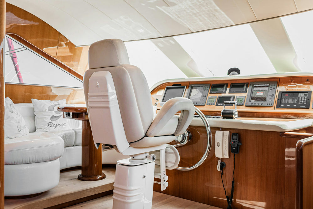 Bright yacht interior with helm and lounge seating